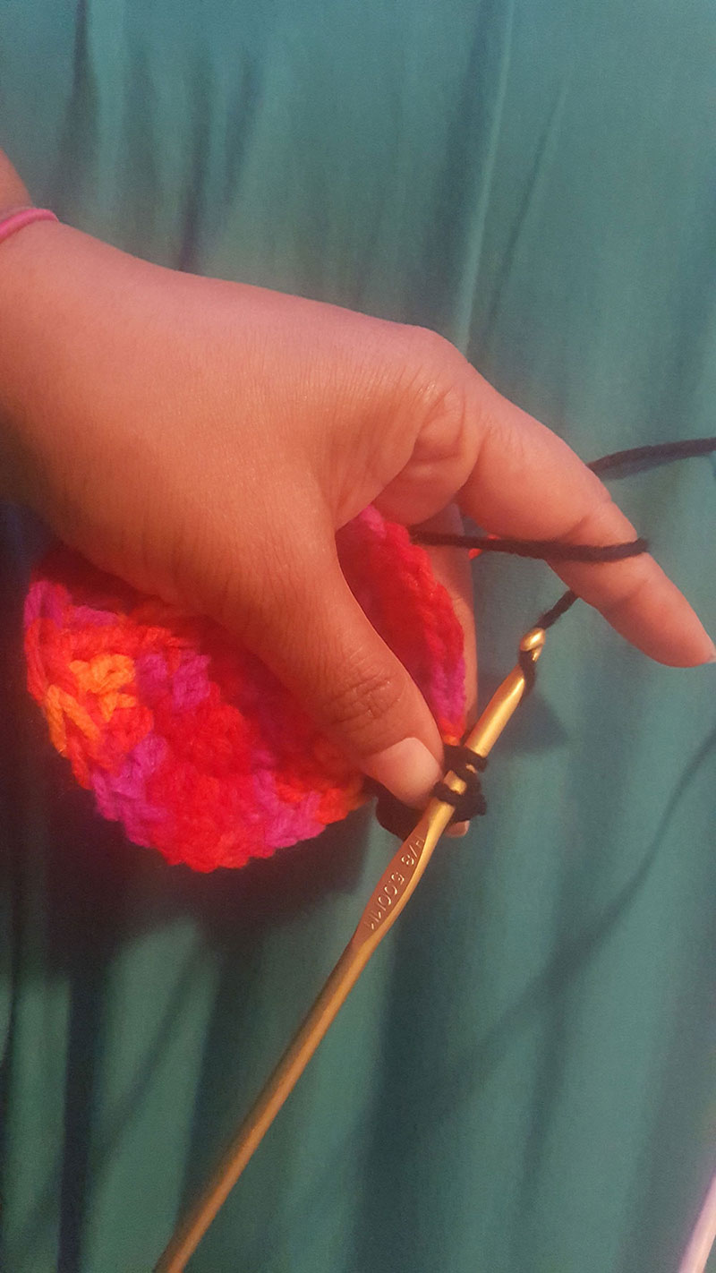 A photo of a hand knitting
