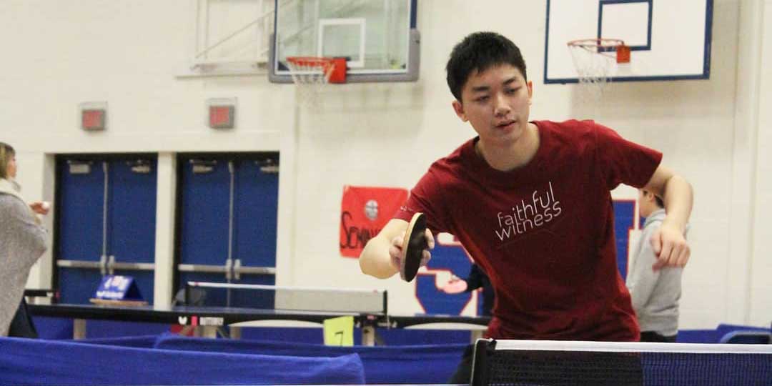 Photo of the student author of this article playing table tennis