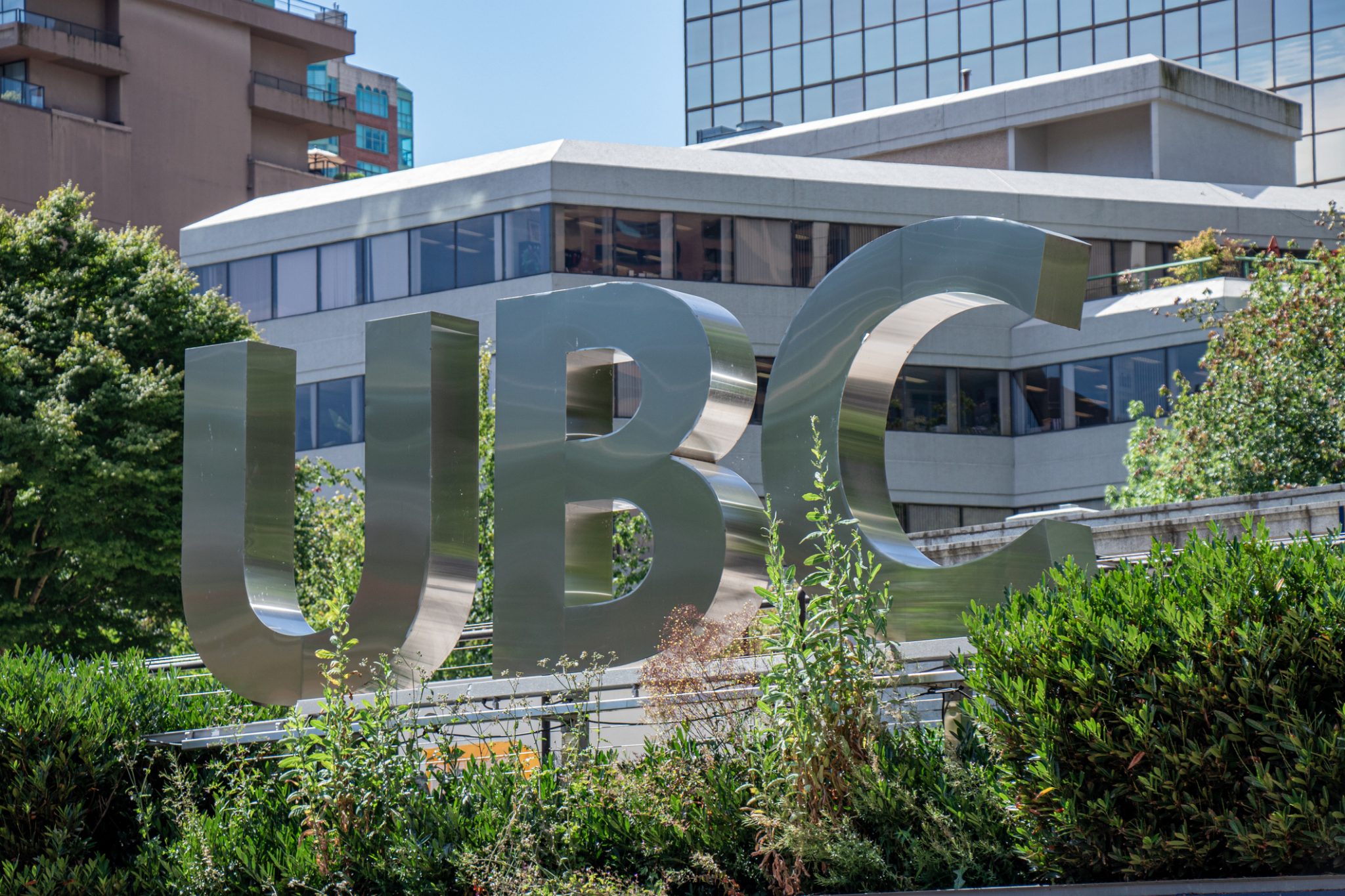 View of sign UBC Robson Square in Downtown Vancouver. Sunny day.